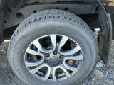 a close up of a tire on a black car