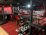 an image of a large room with red carpet and red walls