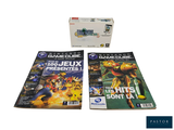 une boîte de jeux et une GameCube posées sur la table