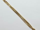 a gold bracelet with a chain that is attached to it