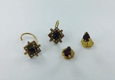three pairs of gold and amethorate earrings and a pair of amethorate earrings