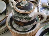 a lot of plates and cups on a table