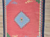 an image of a rug hanging on a wall in a room