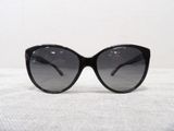 sunglasses on a table with a white background and a white wall