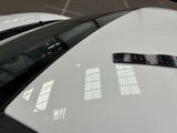 a sticker on the hood of a white car