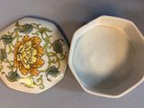 a small bowl and a small bowl sitting on a table