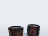 pair of small wooden planters on a white surface