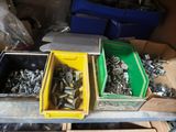 many different types of screws and nuts in the bins