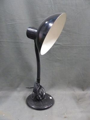 a black lamp that is sitting on a table