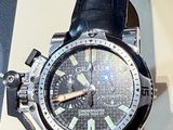 a watch that is on display on a table