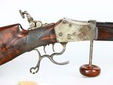 an old gun with a wooden handle and a metal handle