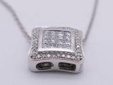 a picture of a diamond necklace on a white surface