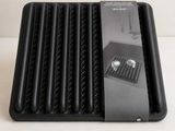 a black tray that has a bunch of food inside of it