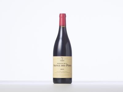 a bottle of red wine sitting on top of a table