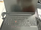 a laptop computer sitting on top of a black bag