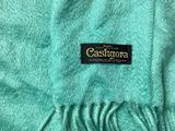 the label on a green scarf is on a white background
