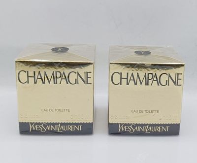 two boxes of champagne on a white surface with a white background