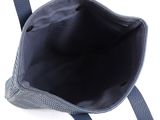 the inside of a blue purse on a white background