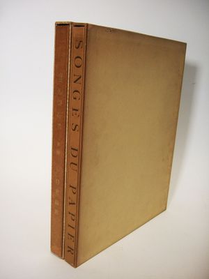 an old book sitting on top of a white table
