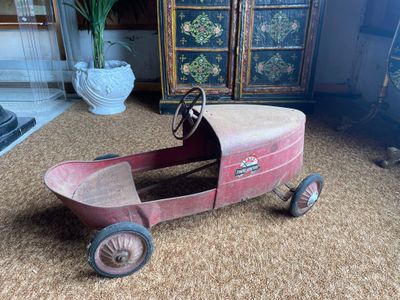 a small toy car that is sitting on the floor