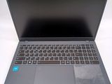 a laptop with a keyboard on it sitting on a table