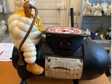 a figurine of a man on a motorcycle with a helmet on