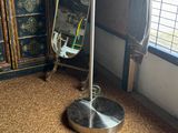 a lamp that is on a stand in a room