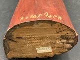 a close up of a piece of wood with writing on it