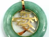 chinese symbol in a circle pendant with a gold plated base