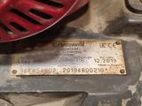 a close up of a metal plate with a name tag on it