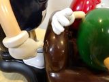 a figurine of a man playing with a ball