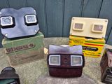 many different types of cameras sitting on a table