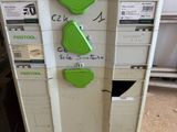 an image of a green and white recycling machine in a room