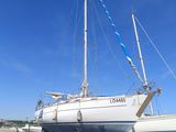 a boat that is sitting on the ground in the sand