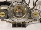 many different types of clocks on display on a table