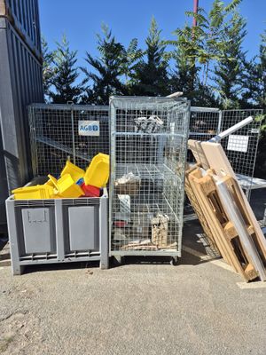 a metal cage with a bunch of items inside of it