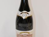 a bottle of wine that is sitting on a table