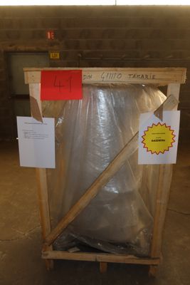a wooden crate with a plastic bag on top of it