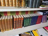 many books that are on the shelves in the room
