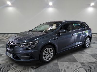 the grey car is parked in the garage on a checkered floor