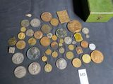 a lot of coins that are sitting on a table