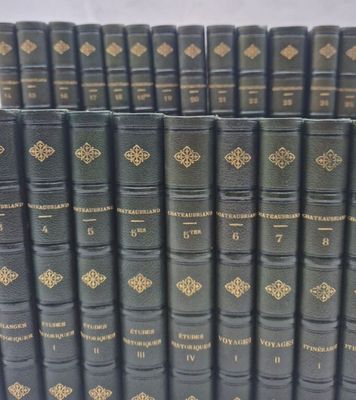 a lot of books that are sitting on a table