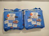 two bags of food sitting on a table