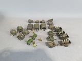 a lot of toy army vehicles on a table