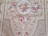 a rug with a floral design on it on the floor