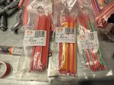 many different colored pencils in a bag on a table