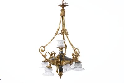 a chandelier hanging from the ceiling with a bird on it