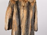 a close up of a fur coat on a mannequin stand