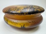 a yellow and black box with a tree on it