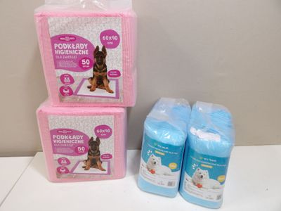 three boxes of toilet paper and a dog sitting on a table